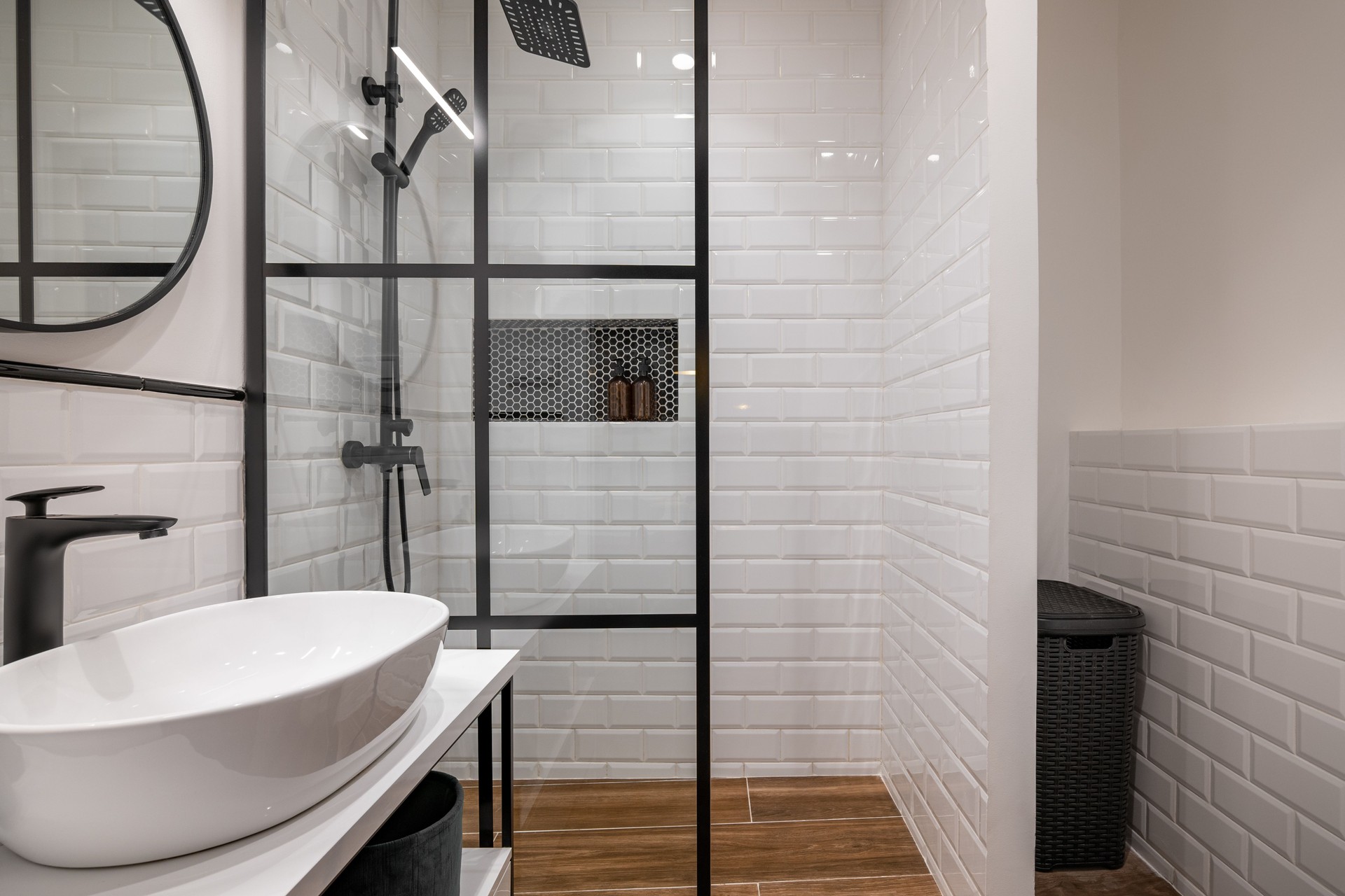 Modern Bathroom with Glass Shower and White Tile Walls